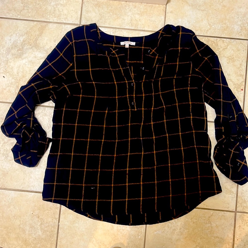 Skies are blue plaid henley top.  Tie up sleeves.